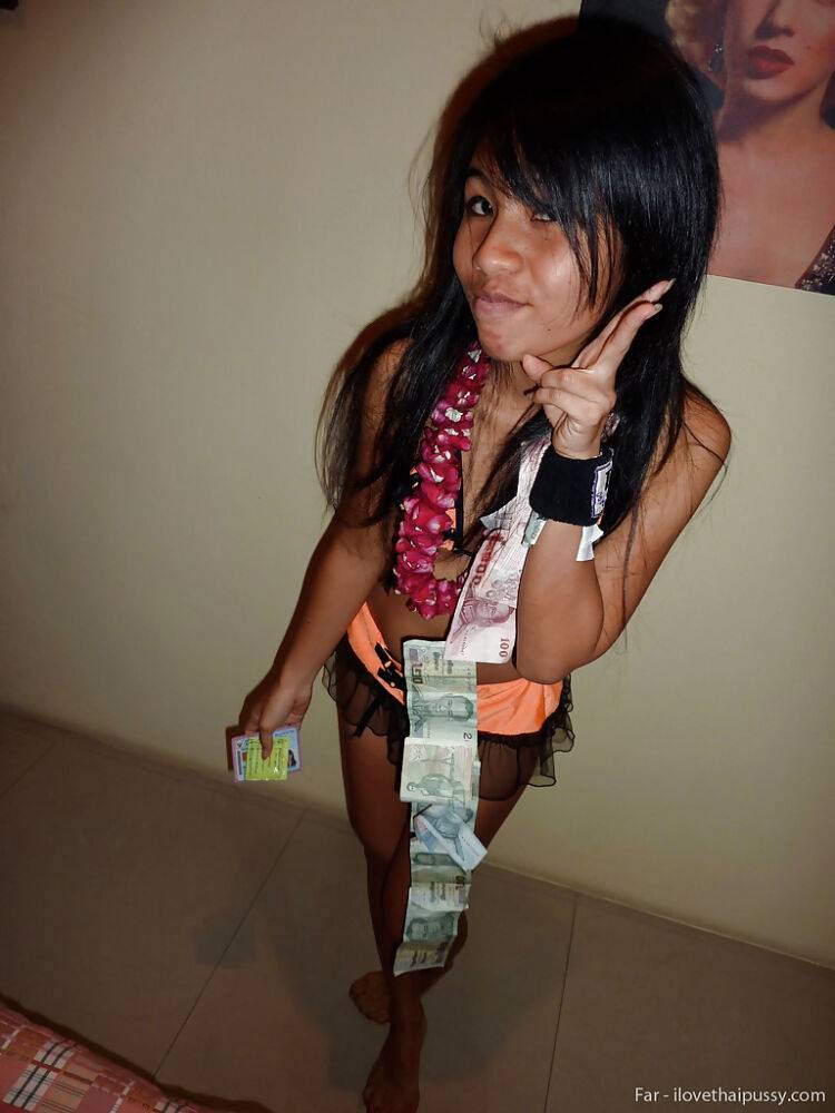 Petite Thai bar girl showing off her shaved pussy for money - #1