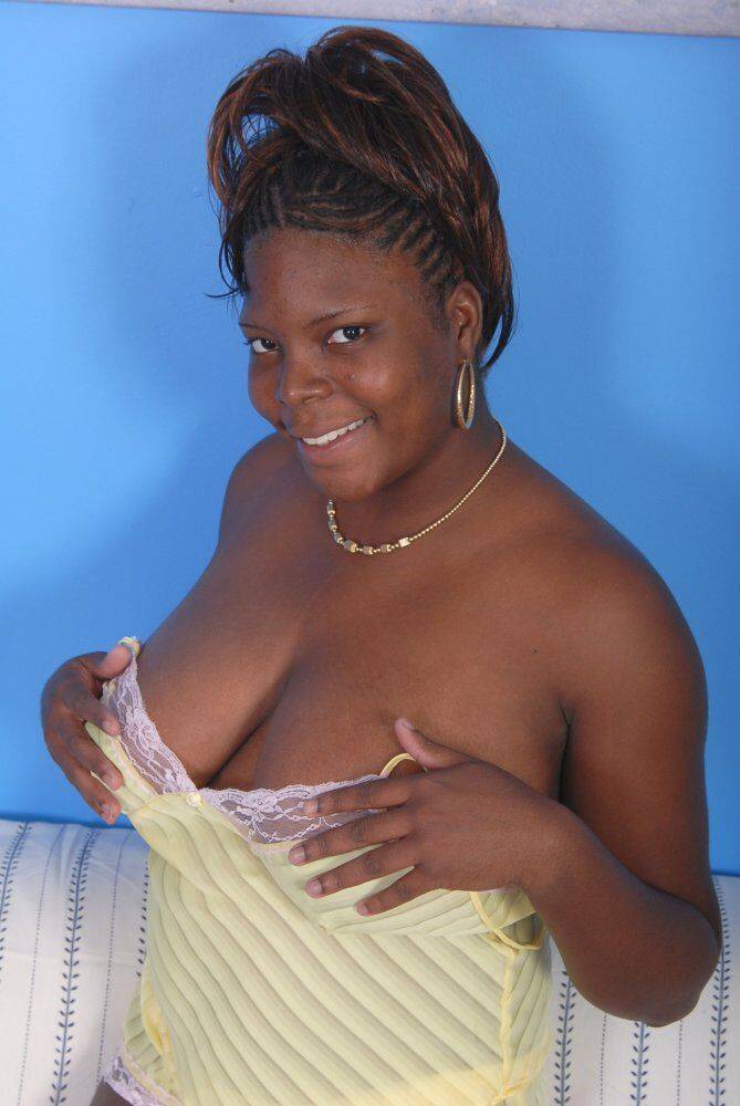 Thick ebony chick places hands over her exposed big naturals - #11