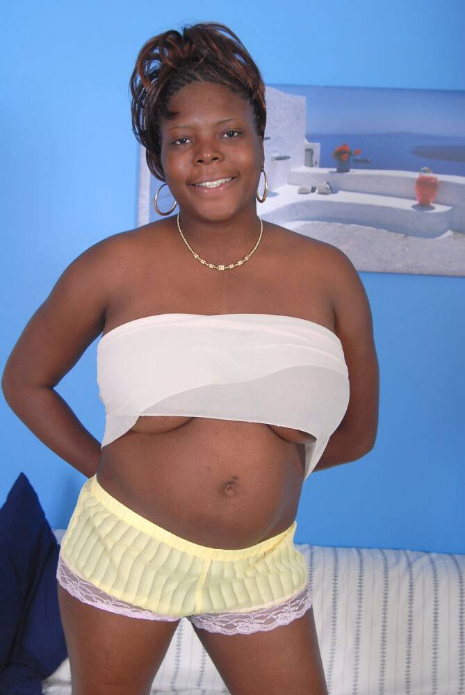 Older black woman Athena holds her large breasts while getting undressed - #12