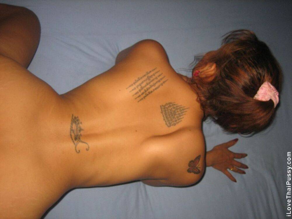 Tattooed Thai woman Vee masturbates while eating jizz after fucking a customer | Photo: 653073