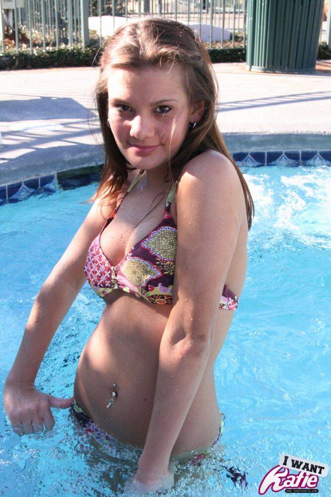 Cute teen Kate Crush covers up her bare tits after removing bikini top in pool - #12