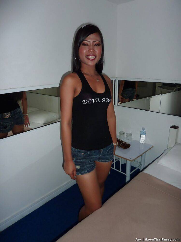 Seductive asian babe with slender legs posing in jeans shorts and black top - #8