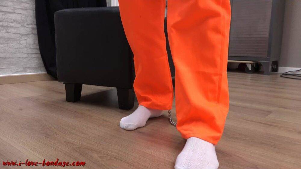 Female prisoner is left alone while cuffed in an orange jumper and white socks - #3