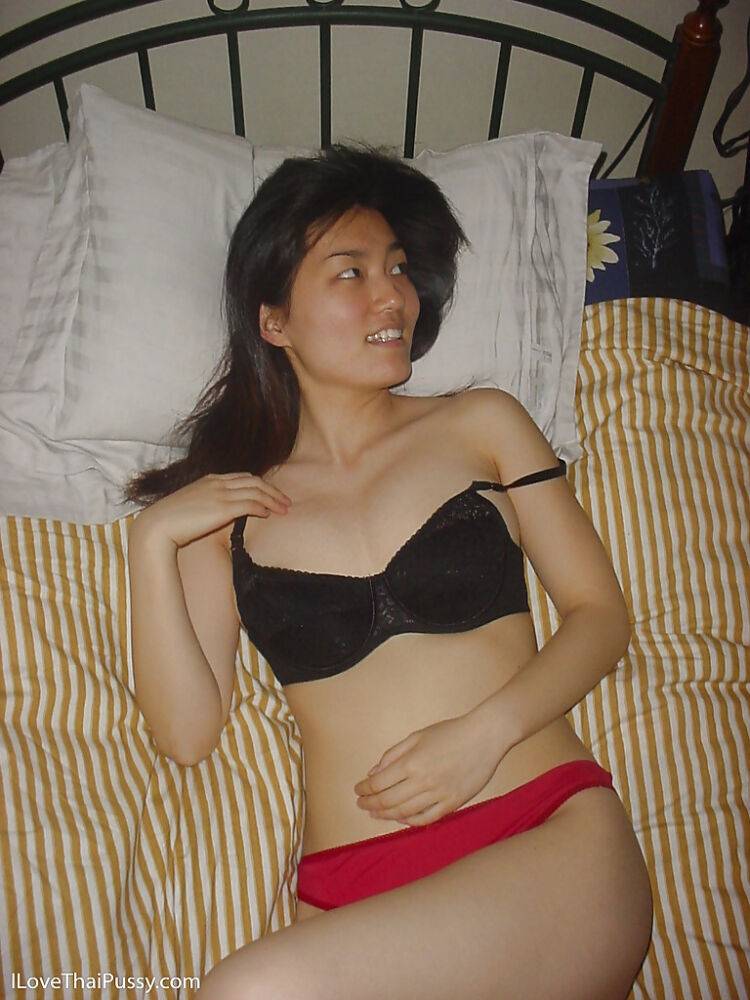 Seductive asian babe slipping off her clothes and showing off her big tits - #10