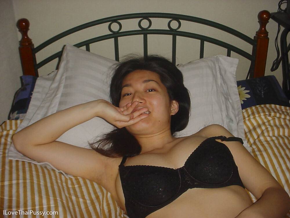 Seductive asian babe slipping off her clothes and showing off her big tits - #11