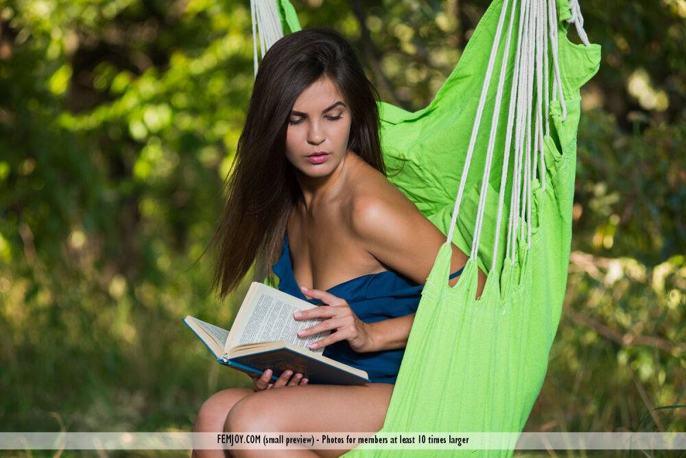 Beautiful brunette Arina B gets totally naked outdoors on a hammock - #6