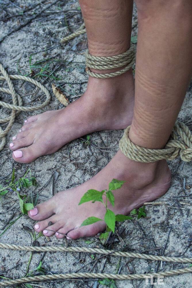 Skinny chick Jacinta B is tied up and suspended by rope in the woods - #3