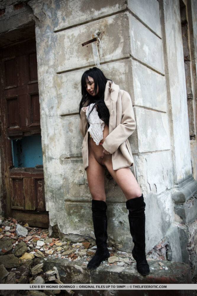 Horny teen Lexi B fingers her pussy behind an old building in a coat and boots - #9