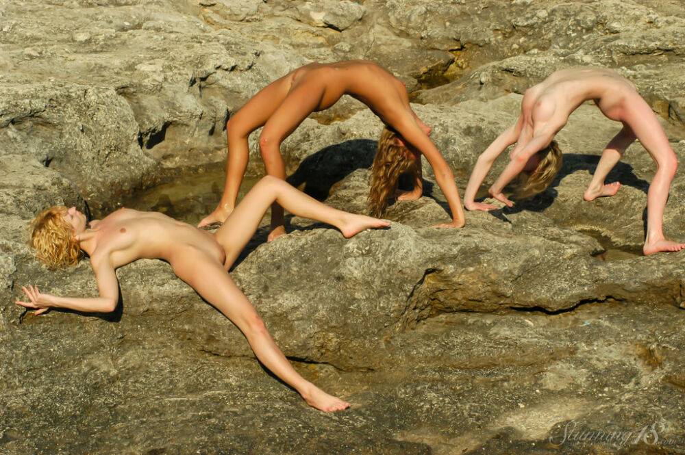 Teen lesbians Kozma O, Dorinda N and Agape B frolic naked in a tidal pool - #6