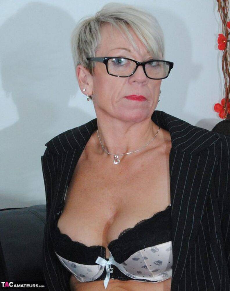 Mature lady Shazzy B sports short hair while exposing her upskirt underwear - #12