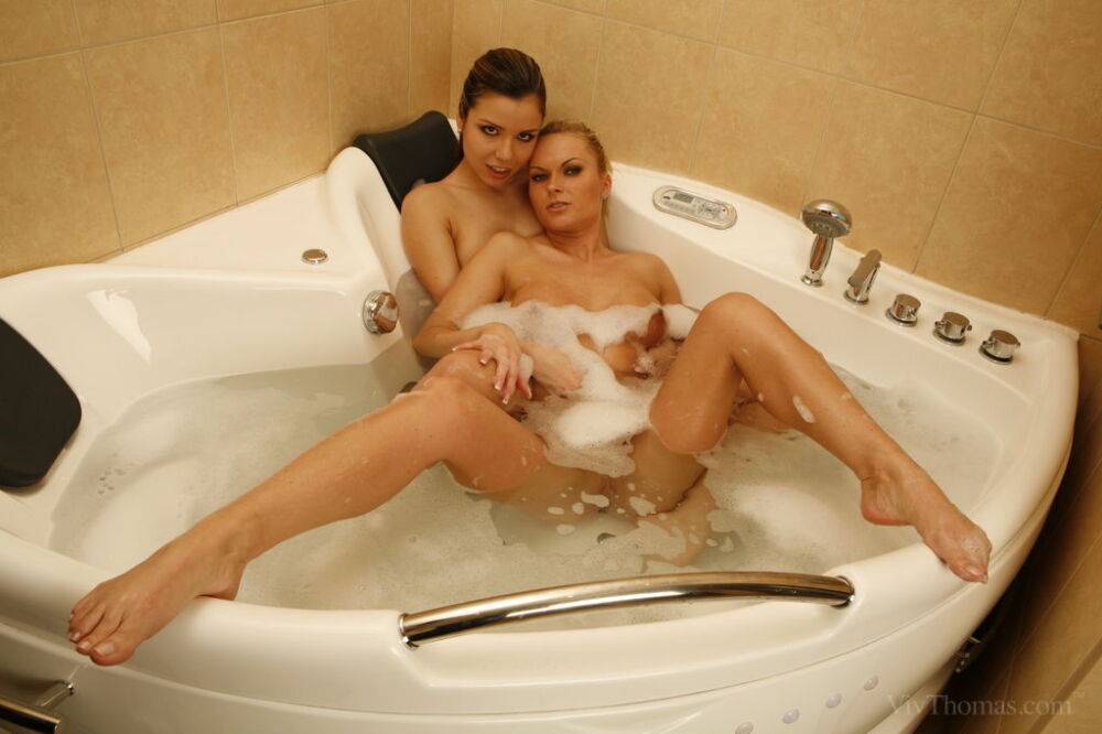 Lesbian girls Peaches A & Gina B finger twats and assholes while in a bathtub - #2