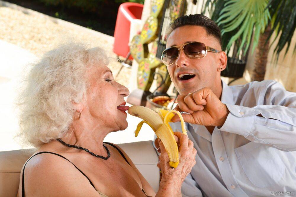 Old platinum blonde Norma B playfully eats fruit before a hardcore toyboy fuck - #6