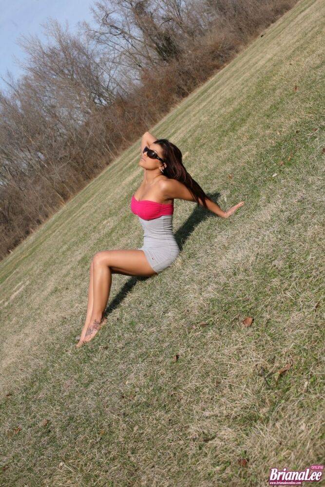 Brunette amateur Briana Lee hikes up her tight skirt in the middle of a field - #13