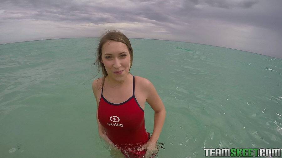 Teen babe Kimber Lee flashing large natural tits in the ocean - #9