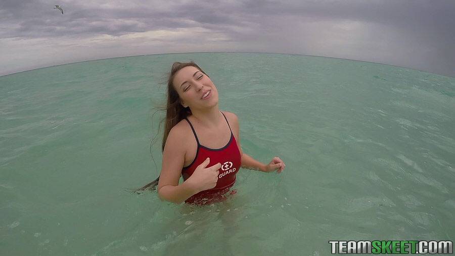 Teen babe Kimber Lee flashing large natural tits in the ocean - #6