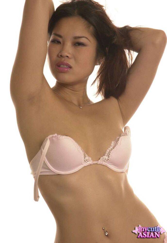 Slim Asian model stands naked after peeling off bra and panty combo - #7