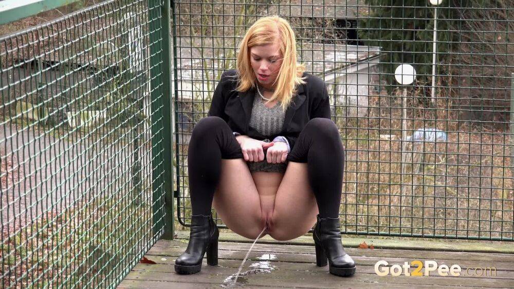 Blonde Chrissy gets short taken and pisses squatting on the deck - #9