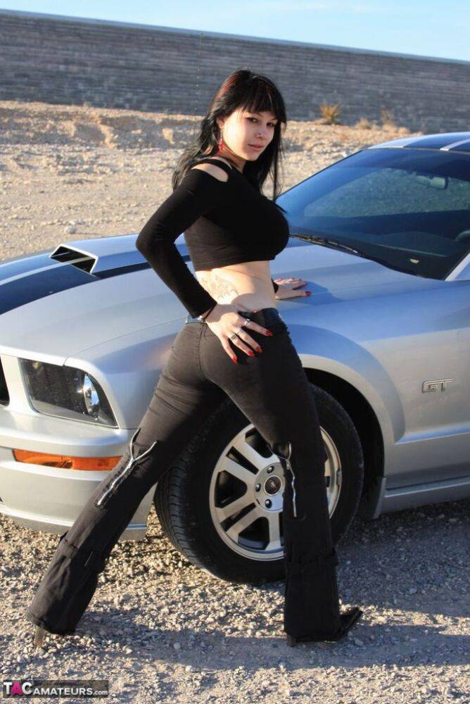 Brunette amateur Susy Rocks models by a muscle car during a safe for work gig - #4