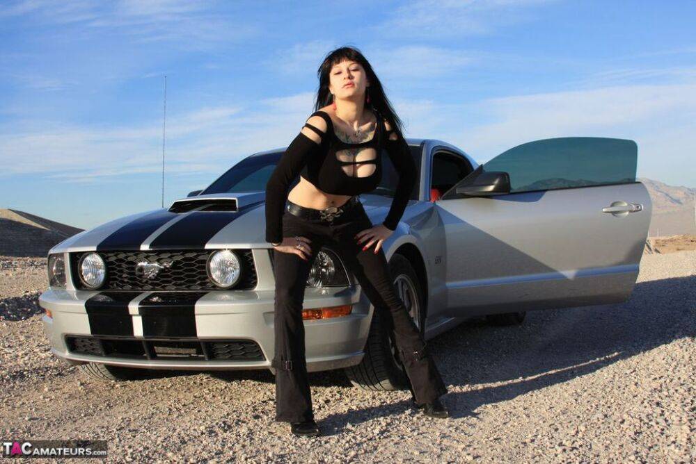 Brunette amateur Susy Rocks models by a muscle car during a safe for work gig - #3