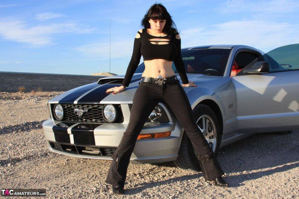 Brunette amateur Susy Rocks models by a muscle car during a safe for work gig - #8