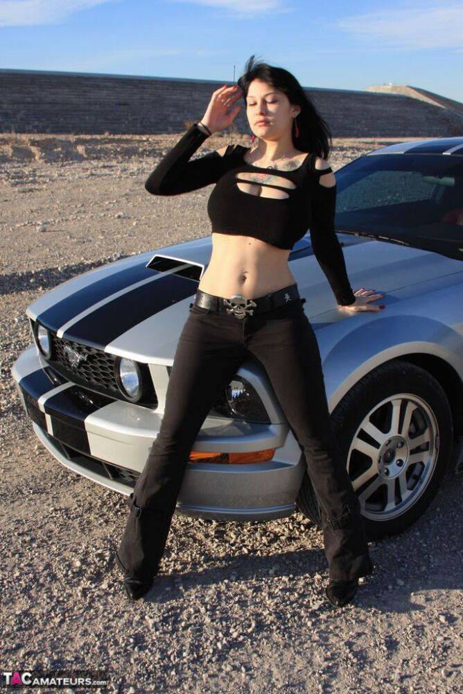 Brunette amateur Susy Rocks models by a muscle car during a safe for work gig - #6