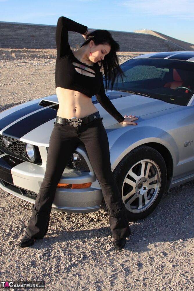 Brunette amateur Susy Rocks models by a muscle car during a safe for work gig - #2