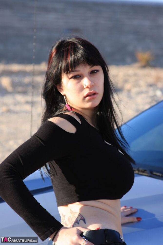 Brunette amateur Susy Rocks models by a muscle car during a safe for work gig - #9