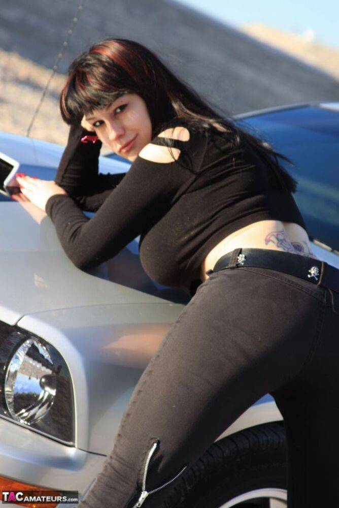 Brunette amateur Susy Rocks models by a muscle car during a safe for work gig - #10