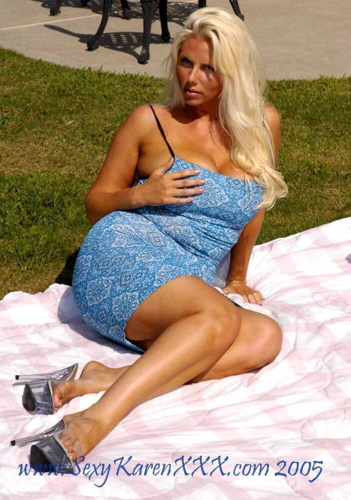 Mature MILF with blonde hair and big boobs masturbates on backyard blanket - #12
