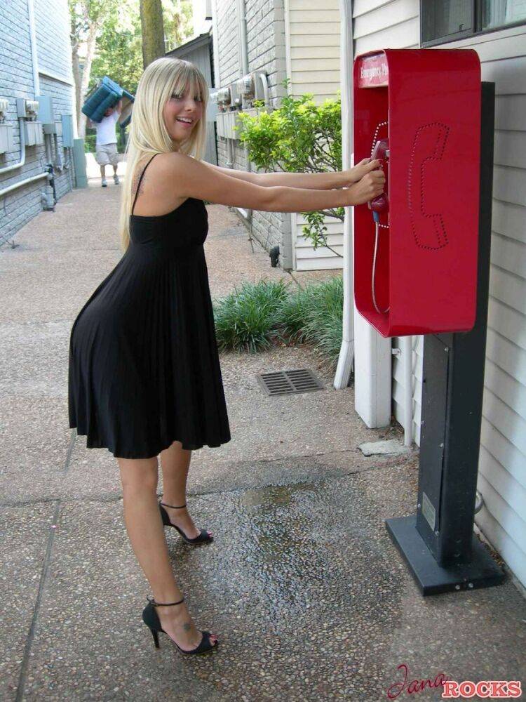 Blonde amateur Jana Jordan flashes her panties at a public phone - #6