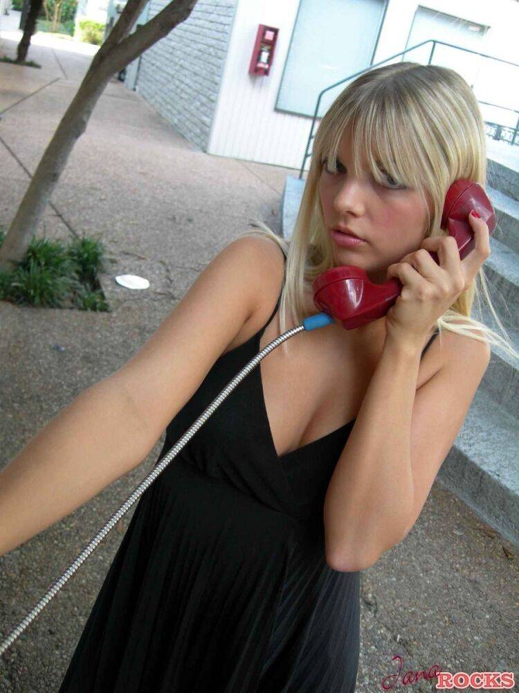 Blonde amateur Jana Jordan flashes her panties at a public phone - #3