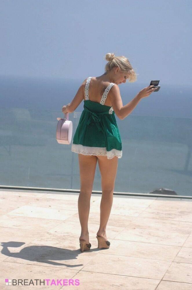 Beautiful blonde Jana Jordan exposes her upskirt panties on a patio - #7