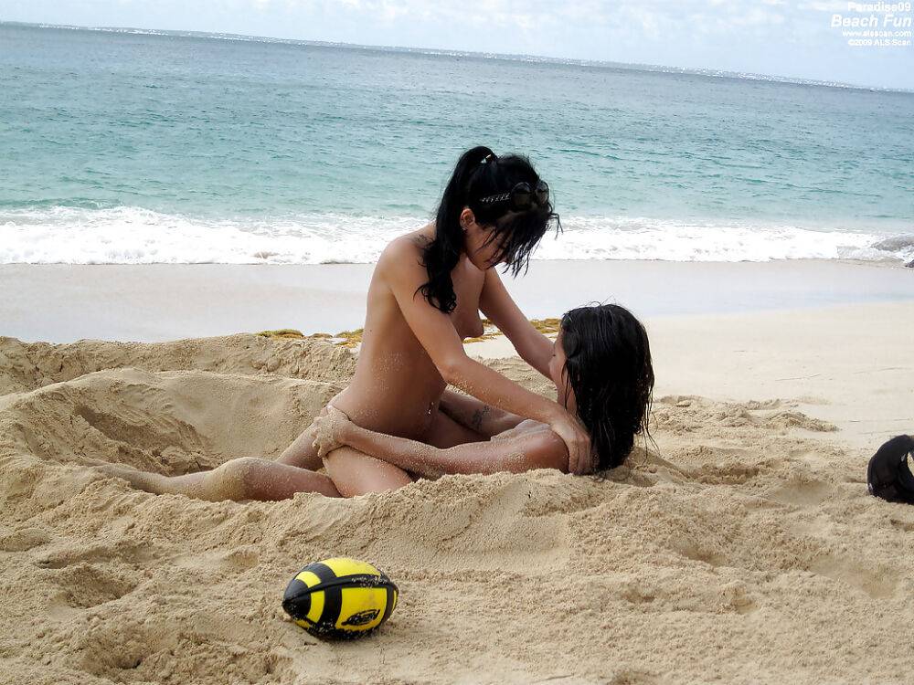 Seductive teenage lesbians stripping and caressing each other on the beach - #4