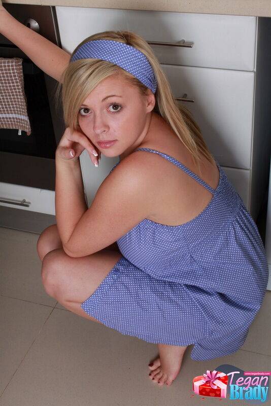 Pretty young Tegan Brady all innocent smiles lifting her dress in the kitchen - #8