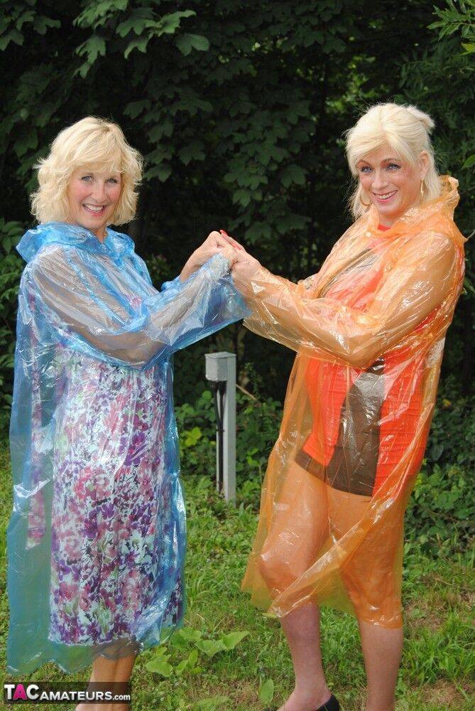 Mature lesbian Dimonty and GF cover their naked bodies in see thru raincoats - #6