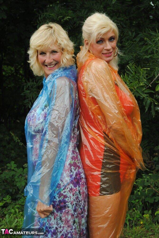 Mature lesbian Dimonty and GF cover their naked bodies in see thru raincoats - #9