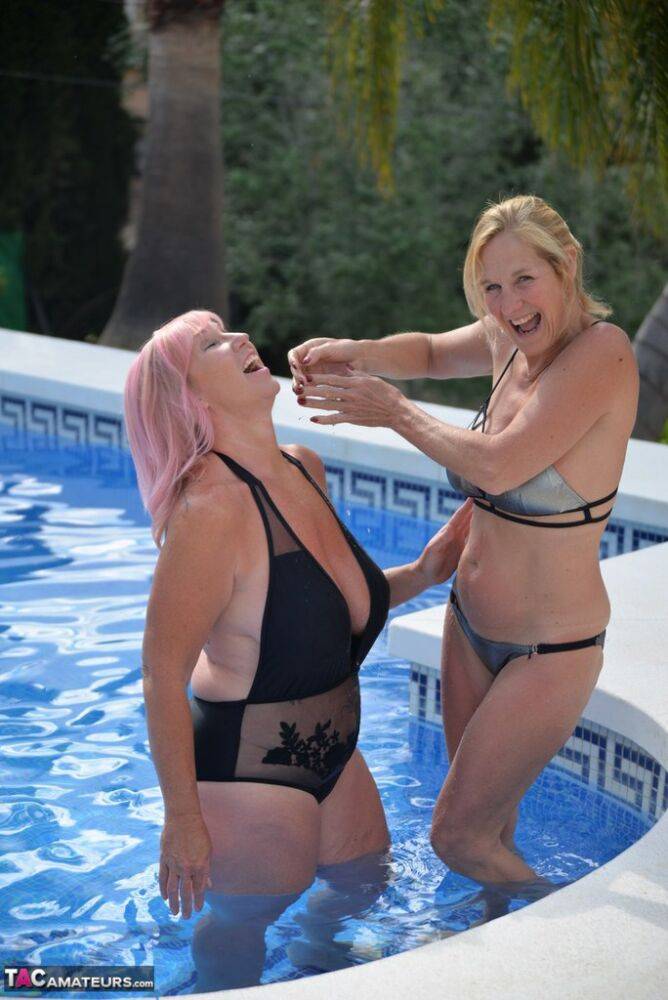 Mature blonde women frolic in a swimming pool with their swimsuits on - #3