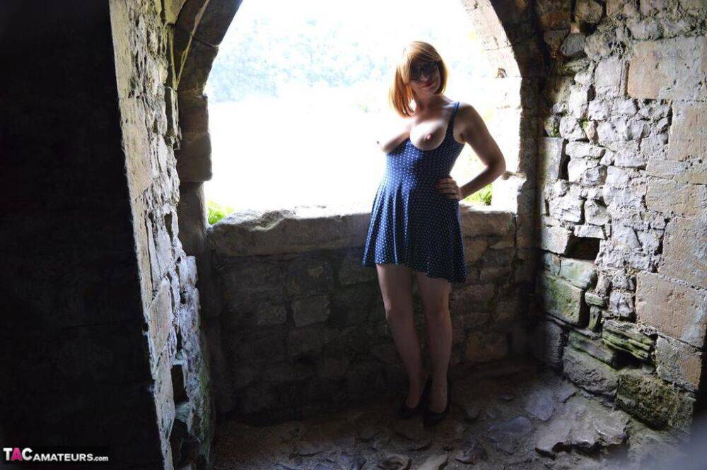 Redheaded amateur Barby Slut gets totally naked while wandering castle grounds - #7