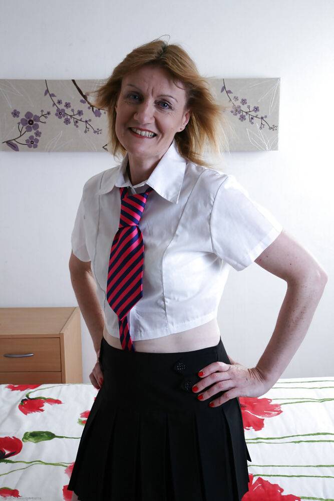 Lecherous mature slut in sexy school uniform undressing and teasing her twat - #12