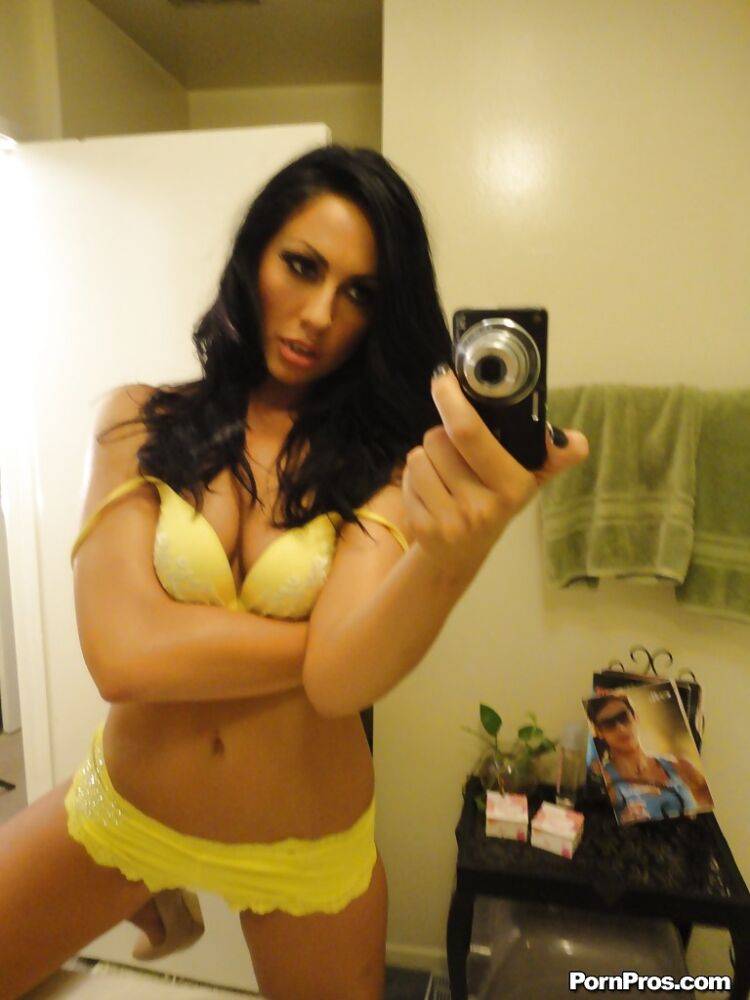 Brunette slut Tiffany Brookes taking mirror self shots while undressing | Photo: 1216651