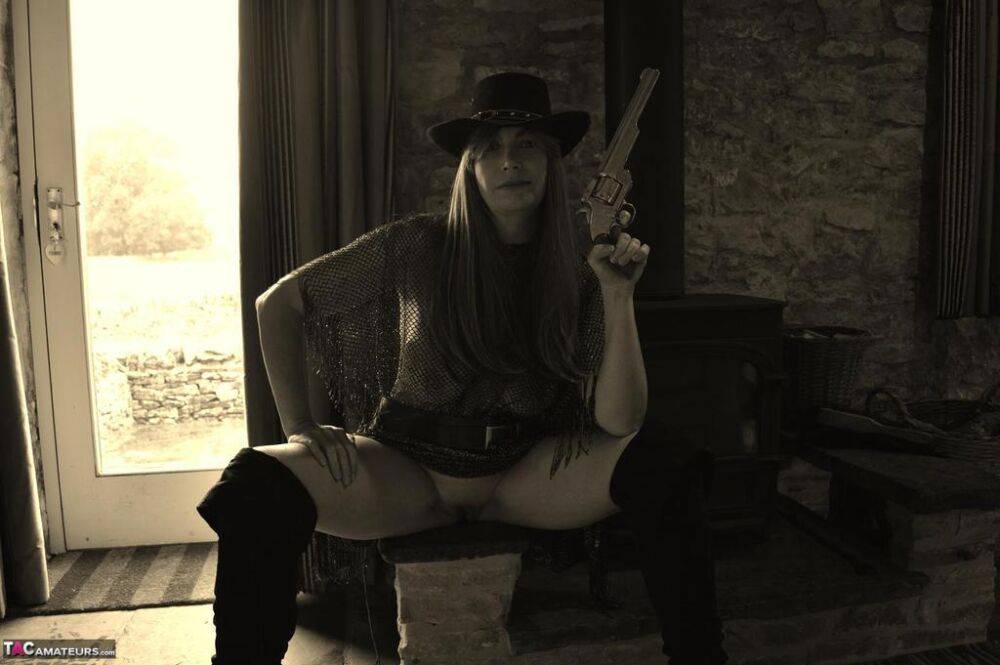 Busty amateur Barby Slut poses for a black-and-white Western themed shoot - #3