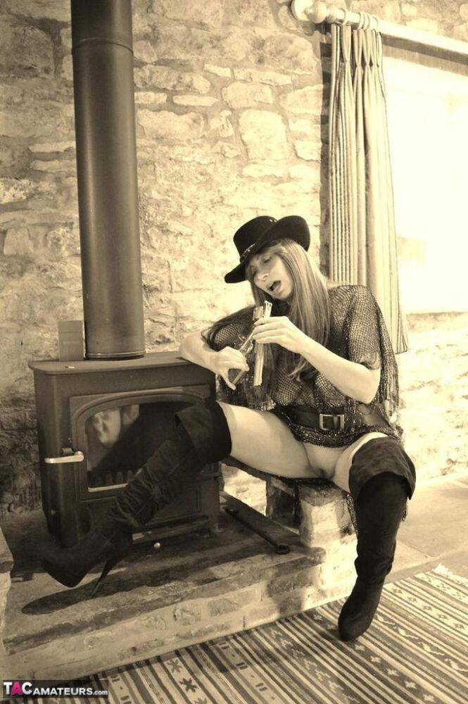 Busty amateur Barby Slut poses for a black-and-white Western themed shoot - #6