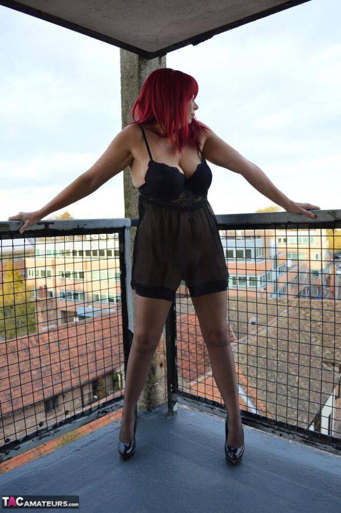 Older redhead Barby Slut exposes herself on the balcony of her condo - #14