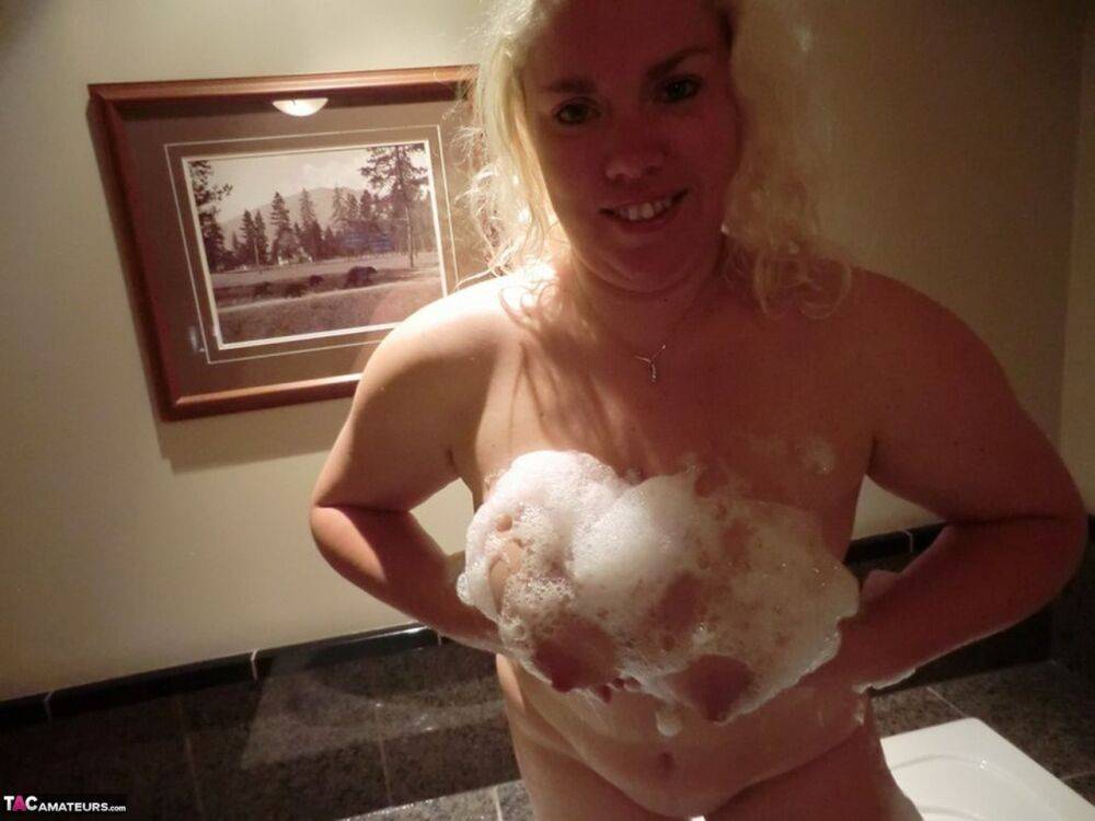 Mature blonde Barby soaps up her big boobs while taking a bath - #9