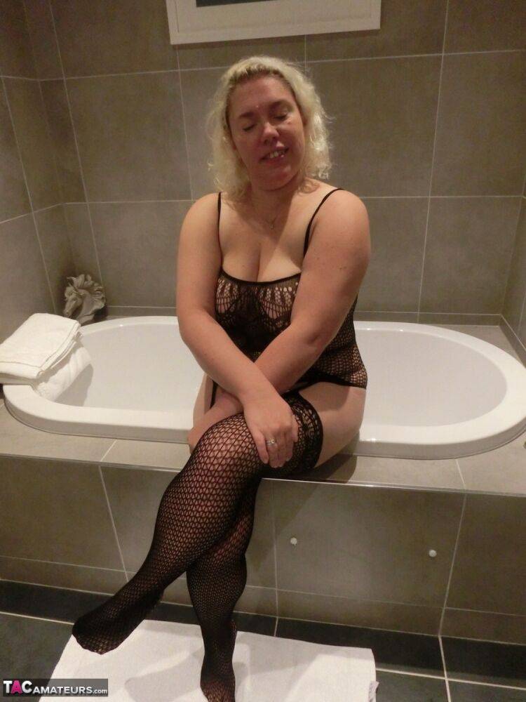 Mature blonde Barby takes off her sexy bodystocking after showering in it - #6