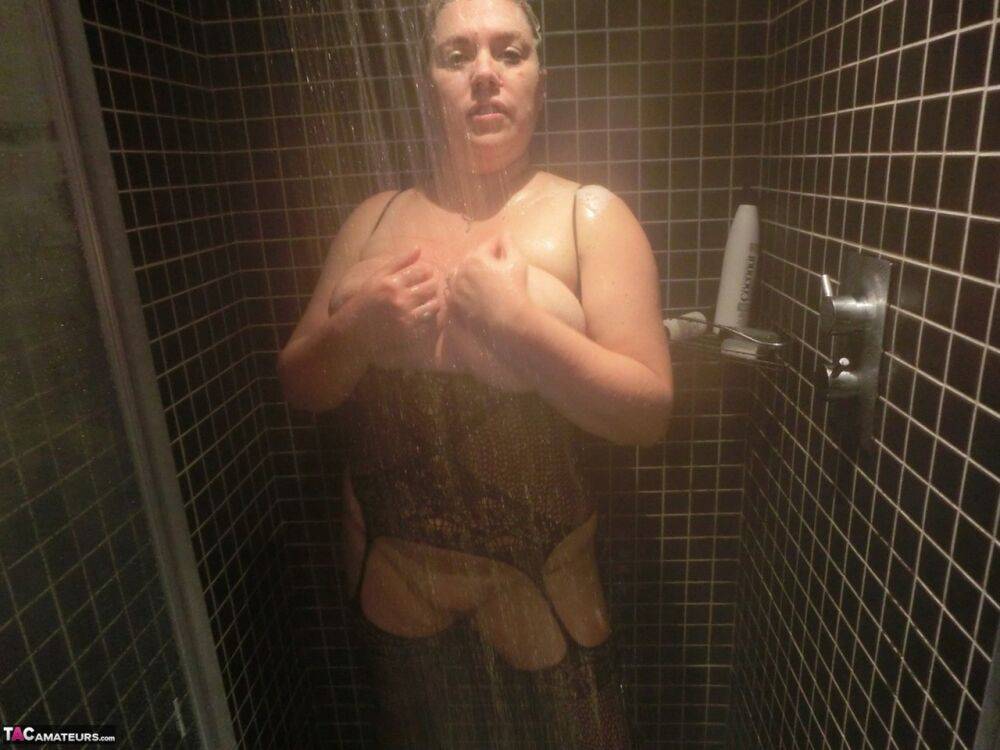 Mature blonde Barby takes off her sexy bodystocking after showering in it - #15