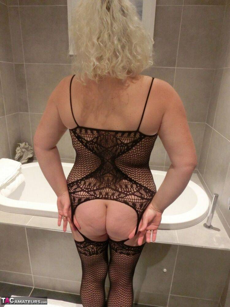 Mature blonde Barby takes off her sexy bodystocking after showering in it - #14