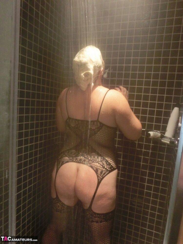 Mature blonde Barby takes off her sexy bodystocking after showering in it - #7