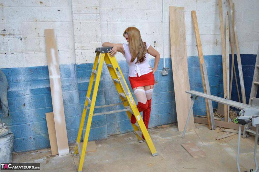 Middle-aged woman Barby Slut gets naked at a job site in OTK boots & nylons - #16