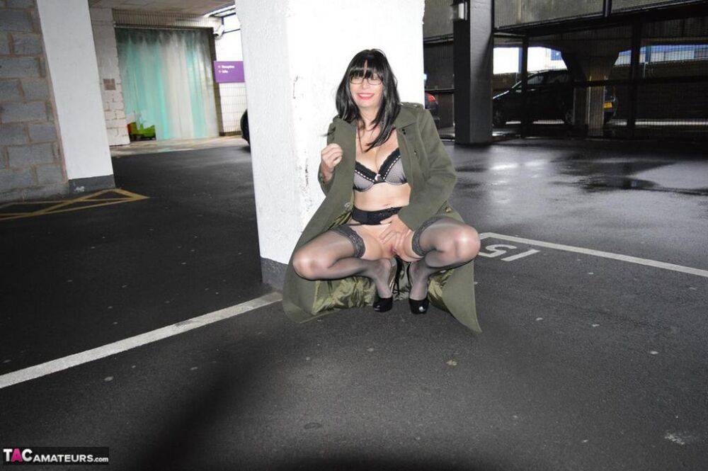 Older brunette Barby Slut flashes in a long coat while in public places - #14